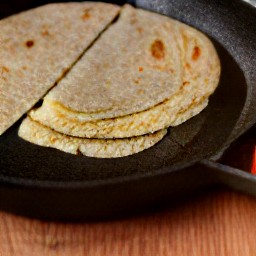 the cheese chapati sandwich is cooked in a non-stick frying pan for 4 minutes.