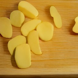 potatoes that have been cut lengthwise.