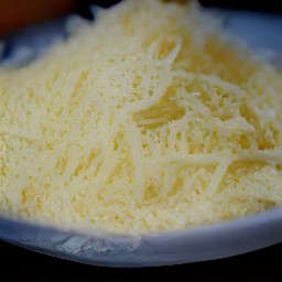 the output is a pile of shredded parmesan cheese.
