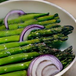 a salad that has been mixed with balsamic vinegar and kosher salt.