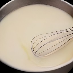 a bowl of soymilk and cider vinegar that has been whisked together and set aside for 3 minutes.