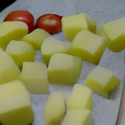 cut potatoes and chopped tomatoes.
