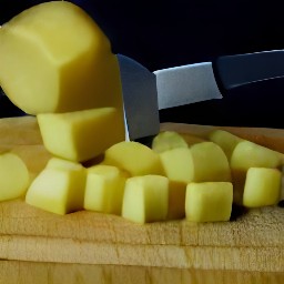 dice peeled potatoes, then peel and mince garlic. next, chop tomatoes and jalapeno peppers.