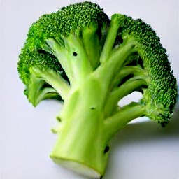 broccoli that is trimmed and cut in half, as well as peeled and chopped garlic.