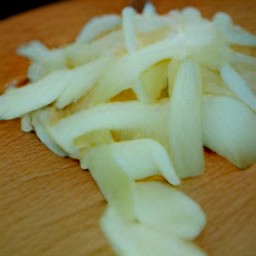 after peeling and slicing the onion, mince the garlic cloves.