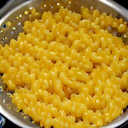 the pasta is drained in a colander.