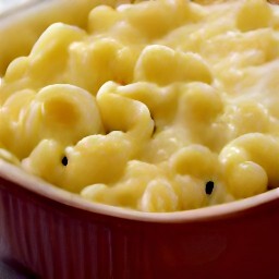 the pasta mixture is transferred to a baking dish and spread out.