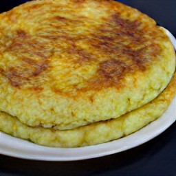 the tortilla is transferred to a platter.