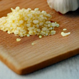 peeled and sliced onions, then peeled and minced garlic.