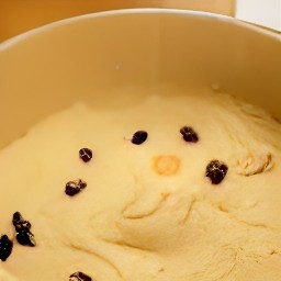 a bowl of batter containing brown sugar, raisins, all-purpose flour, shortening, ground cinnamon, baking powder and baking soda.