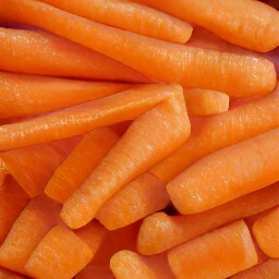 baby carrots that have been cut in half lengthwise.