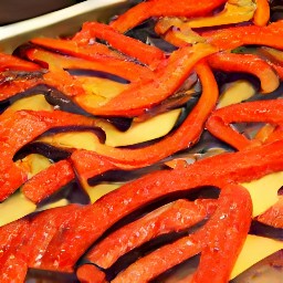 a tray of roasted red bell peppers and eggplants.