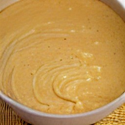 the output is a bowl of batter containing eggs, milk, shortening, cornmeal mixture, and apples.
