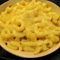 a platter of macaroni with mixed cheese.