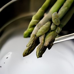 the asparagus is rinsed in a colander.
