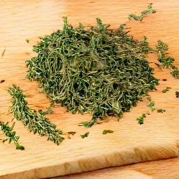 cutting the thyme leaves using scissors would result in small pieces of thyme.