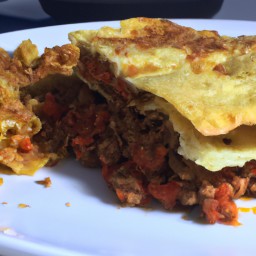 

A delicious, nuts-free Italian baked dish of meatless burger patties and pasta & noodles combined with yellow onions, red wine, tomato paste, San Marzano tomatoes and cheeses for a hearty European lunch.