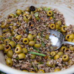 

This gluten-free, eggs-free and soy-free salad is a great light lunch option. It's made of pitted green olives, spring onions, mixed grains, sun-dried tomatoes and flaked almonds - perfect for a delicious variety of flavour!