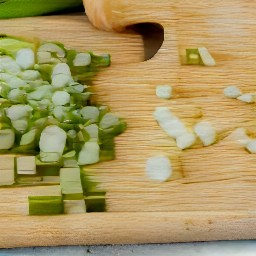 you cook for 1 minute, then remove, and cut spring onions into pieces.