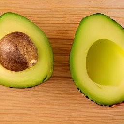 the avocado is cut in half.
