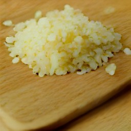 a peeled and minced garlic clove.