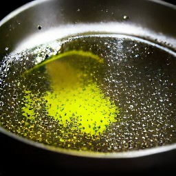 the olive oil heats up in the skillet.