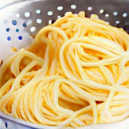 the pasta is drained in a colander.