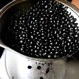 black beans that have been rinsed in a colander.