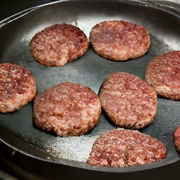 flipping the semi-cooked burger patties with a spatula and cooking for 3 minutes.