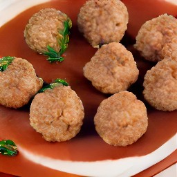 four oval-shaped balls of beef mixture.