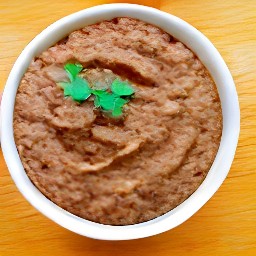 a bowl of warmed vegan refried beans.