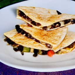 a plate of vegan cheese stuffed tortillas.