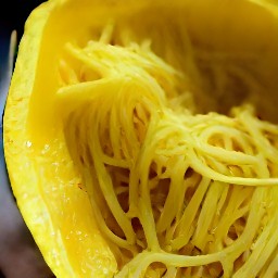 spaghetti squash that has been scraped out with a fork.