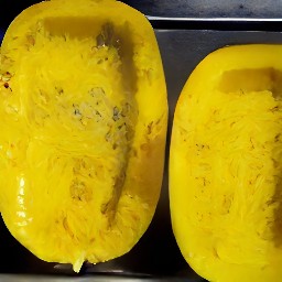 the spaghetti squash is placed on a baking sheet and put in the oven. after 5 minutes, the heat is turned off.