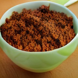 a bowl of beyond beef feisty crumbles mixed with spices and salsa.