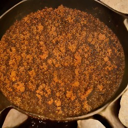 a pan of beyond beef crumbles that are cooked with salt.