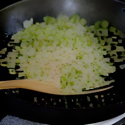 a pan of cooked zucchini with shallots and garlic.