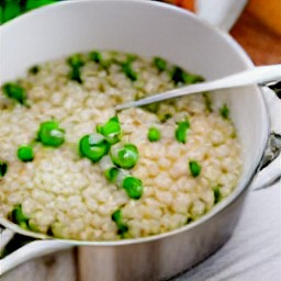 a dish of rice with peas.