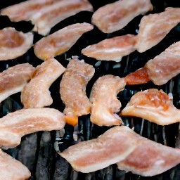 the grill is preheated to 400°f for 10 minutes, and then the smoked vegetarian bacon is added for 7 minutes until crispy.