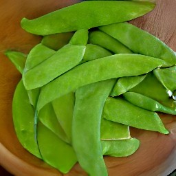 snow peas that are peeled.