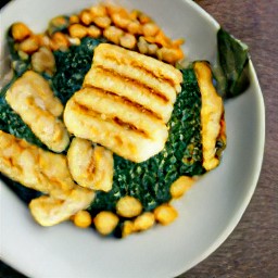 two plates, each with lemon-juice cooked chickpeas and fried cheese on top.