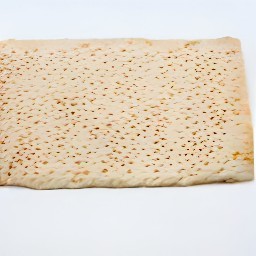 a puff pastry with sesame seeds on top.