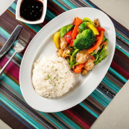 

A delicious vegan and gluten-free Chinese stir-fry lunch of onions, mixed vegetables and basmati rice cooked in soy sauce - eggs-, nuts-, and lactose-free!