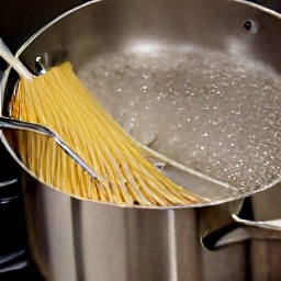 the spaghetti is in the boiling water.