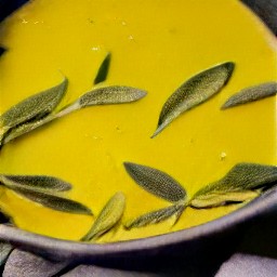 a bowl of sage leaves that have been cooked in butter.