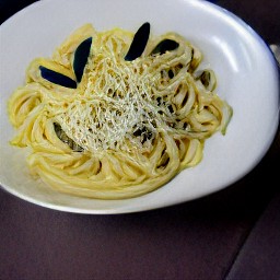 pasta with sauce in bowls, topped with parmesan cheese and half a tsp of black pepper.