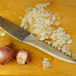 a peeled and finely chopped onion, and diced parsnips and carrots.