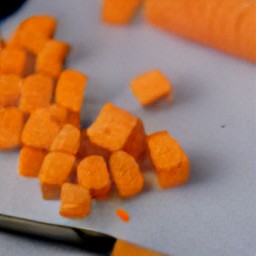 the output is butternut squash that is deseeded and chopped, and carrots that are diced.