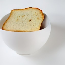 the fried bread is transferred to a bowl.