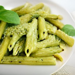 the dish is taken out of the oven and the rest of the basil is scattered over it.